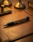 Pen with engraved text on a leather surface